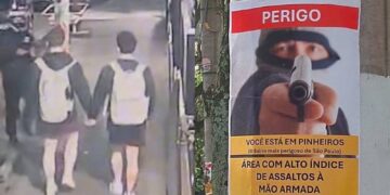 Cartaz alertando sobre a violência no bairro