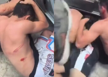 Os torcedores retiraram os homens de um carro e os agrediram