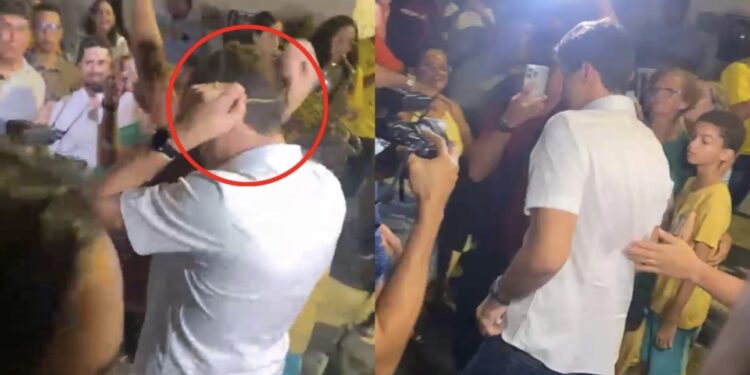 João Campos (PSB) aparece guardando um cordão de ouro durante um evento público