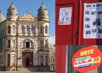 Adesivos colados nas portas e paredes do Palácio do Comércio