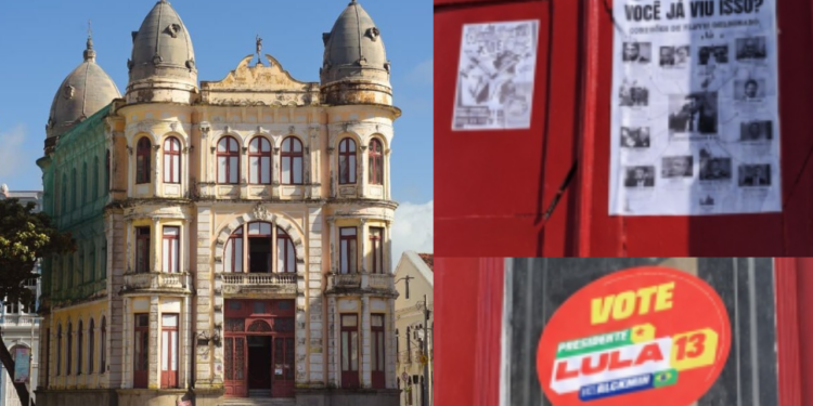 Adesivos colados nas portas e paredes do Palácio do Comércio