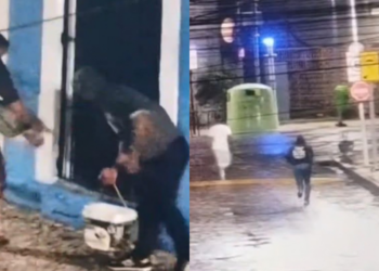 Pessoas encapuzadas espalhando cartazes contra Raquel Lyra (PSD)